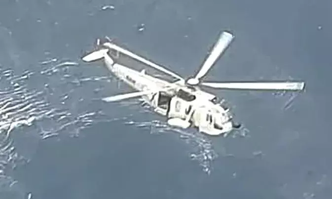 Woman slips into sea, chopper pressed into search operation