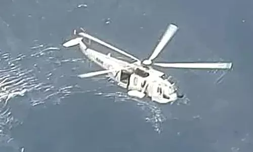 Woman slips into sea, chopper pressed into search operation